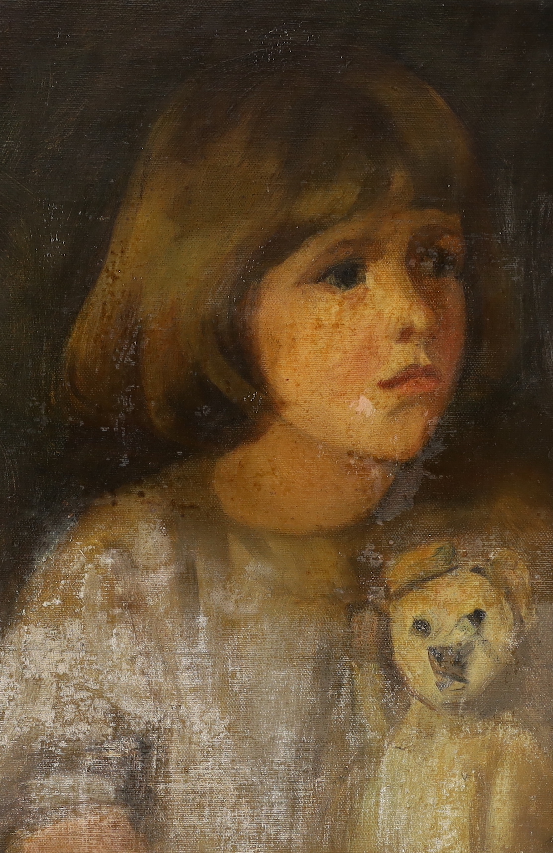 English School c.1900, oil on canvas laid on card, Portrait of a girl with her teddy bear, 37 x 26cm, unframed